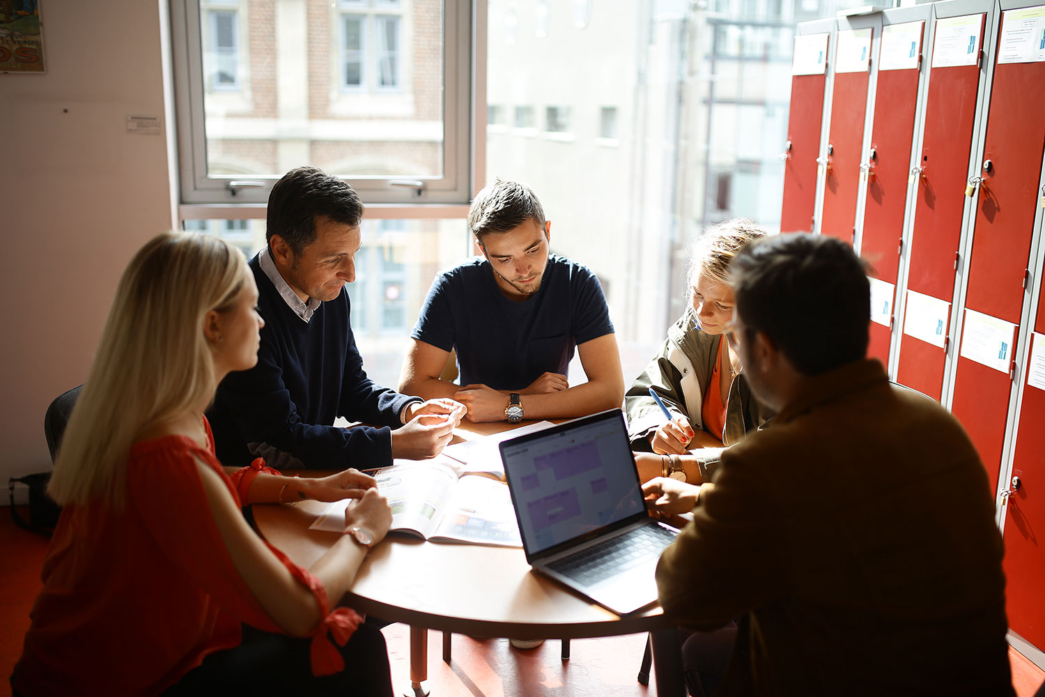 students working with a professors