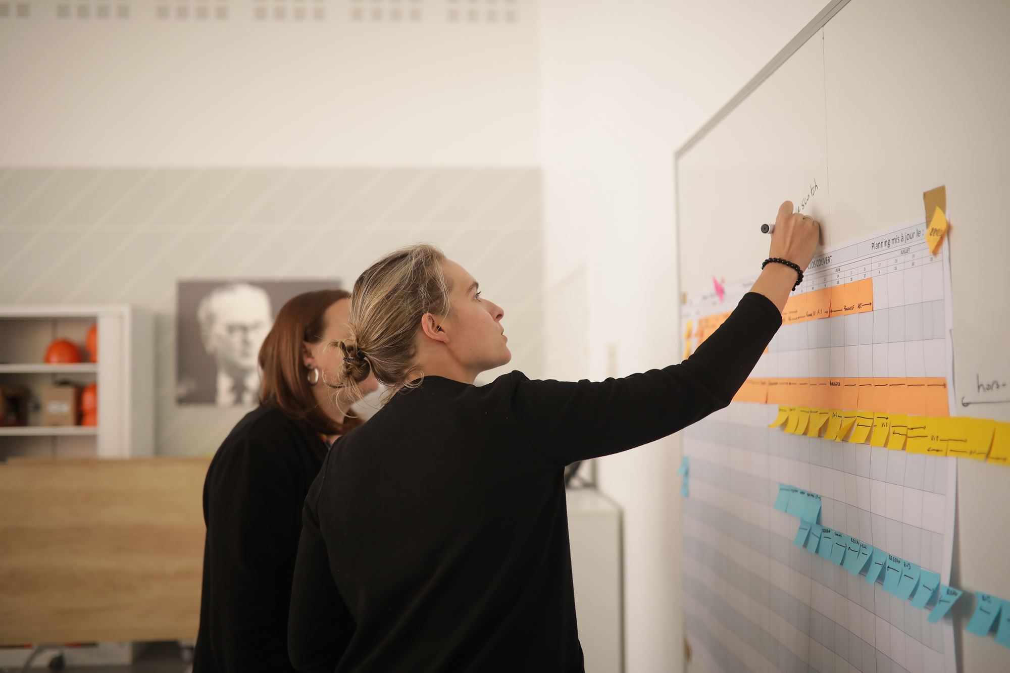 professionals working together on a board