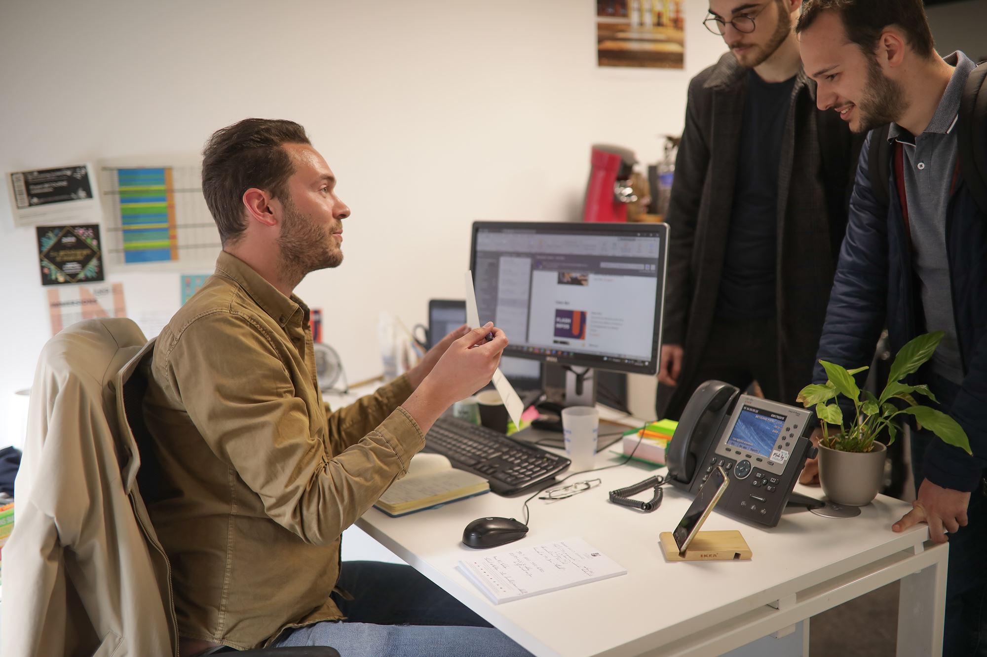 Students talking with a junia collaborator