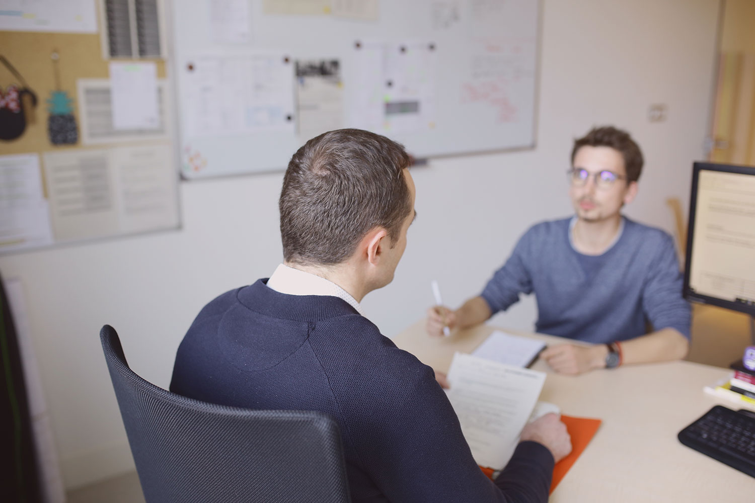 Pofessor speaking with a student