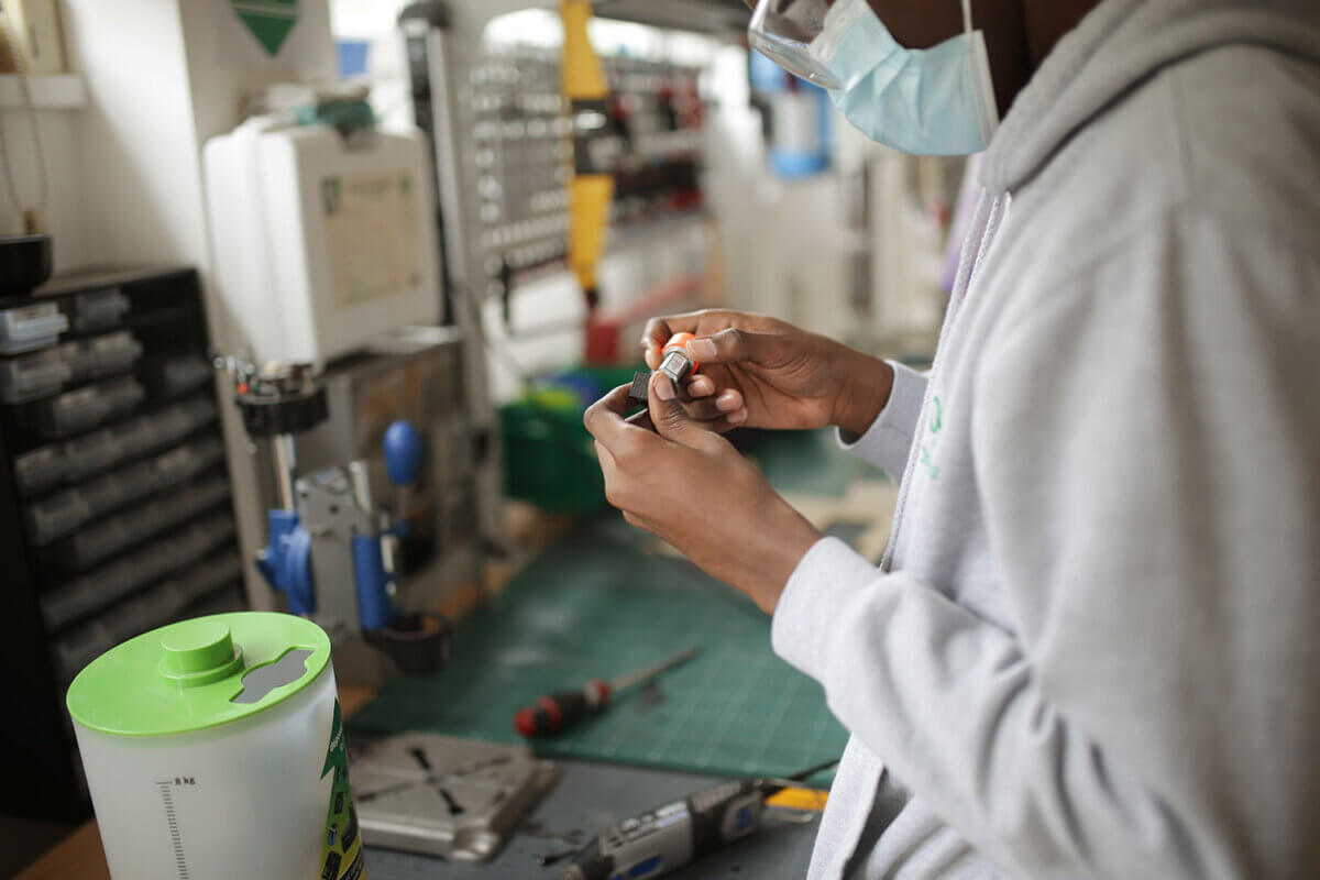 student working on an electric component