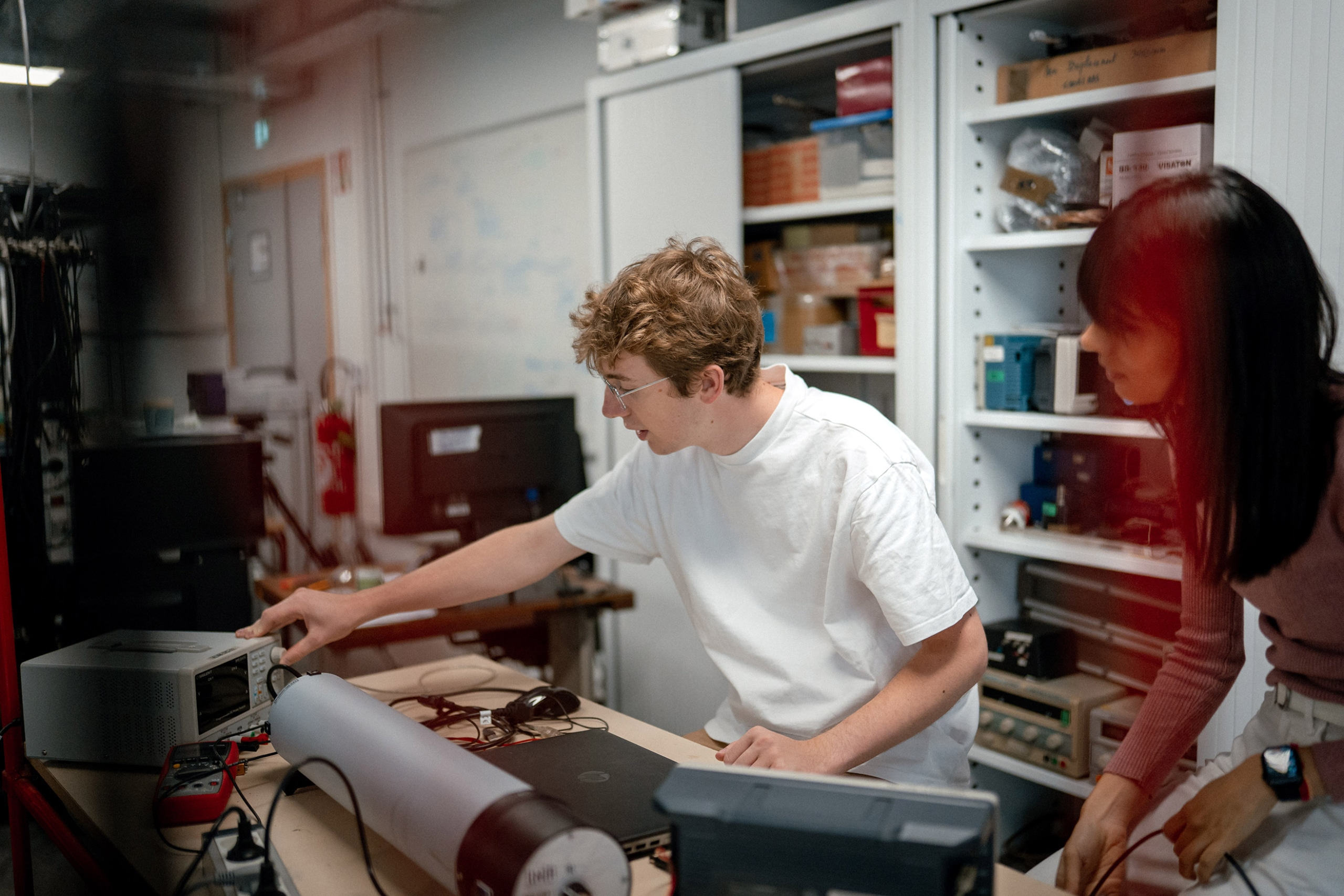 Students working on an electronic device