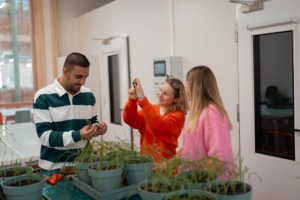 Students making analysis on plants and soil in a lab