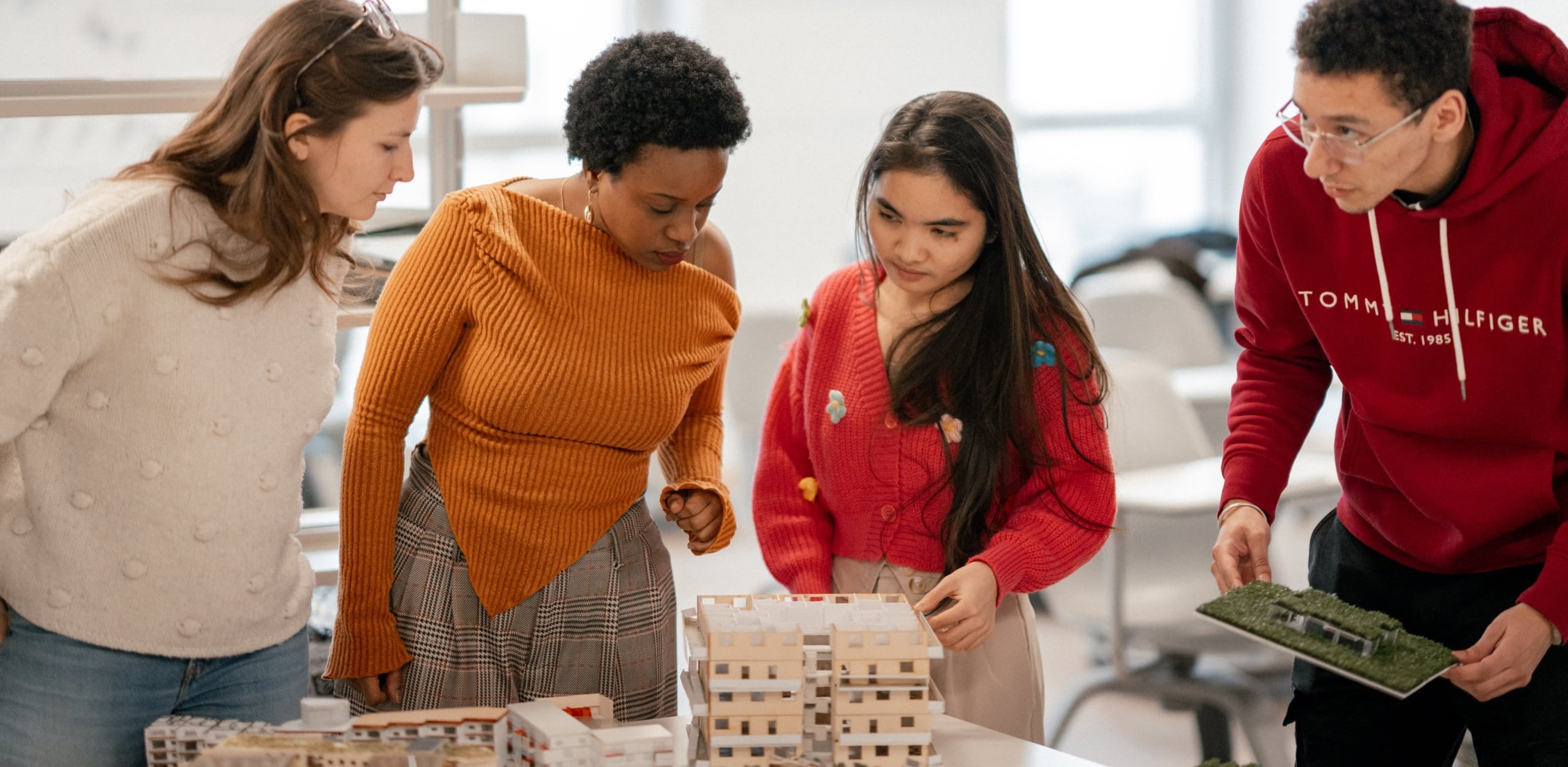 Students working on a building model